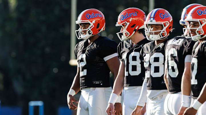 Florida Gators quarterback DJ Lagway (2), Florida Gators quarterback Clay Millen (18) and Florida Gators quarterback Aaron Williams (28) watch a drill during spring football practice at Heavener Football Complex at the University of Florida in Gainesville, FL on Thursday, March 6, 2025. [Matt Pendleton/Gainesville Sun]