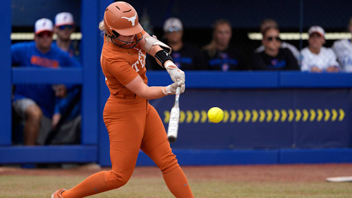 Texas infielder Joley Mitchell (9) hits a home run in the second inning of a Women's College World Series softball game between the Texas Longhorns and the Florida Gators at Devon Park in Oklahoma City, Thursday, May 29, 2025.