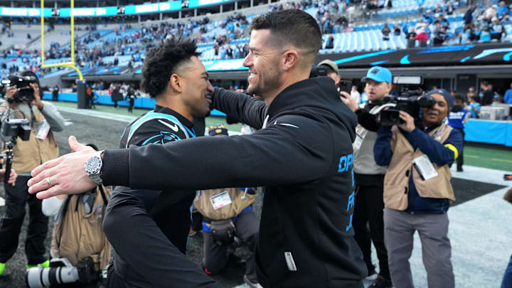 Dec 21, 2025; Charlotte, North Carolina, USA; Carolina Panthers head coach Dave Canales celebrates with quarterback Bryce Young (9) after a game against the Tampa Bay Buccaneers at Bank of America Stadium. Mandatory Credit: Bob Donnan-Imagn Images Dec 21, 2025; Charlotte, North Carolina, USA; Carolina Panthers head coach Dave Canales celebrates with quarterback Bryce Young (9) after a game against the Tampa Bay Buccaneers at Bank of America Stadium. Mandatory Credit: Bob Donnan-Imagn Images