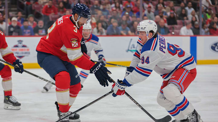Apr 14, 2025; Sunrise, Florida, USA; New York Rangers right wing Gabe Perreault (94) moves the puck against Florida Panthers defenseman Seth Jones (3) during the first period at Amerant Bank Arena. Mandatory Credit: Sam Navarro-Imagn Images Apr 14, 2025; Sunrise, Florida, USA; New York Rangers right wing Gabe Perreault (94) moves the puck against Florida Panthers defenseman Seth Jones (3) during the first period at Amerant Bank Arena. Mandatory Credit: Sam Navarro-Imagn Images