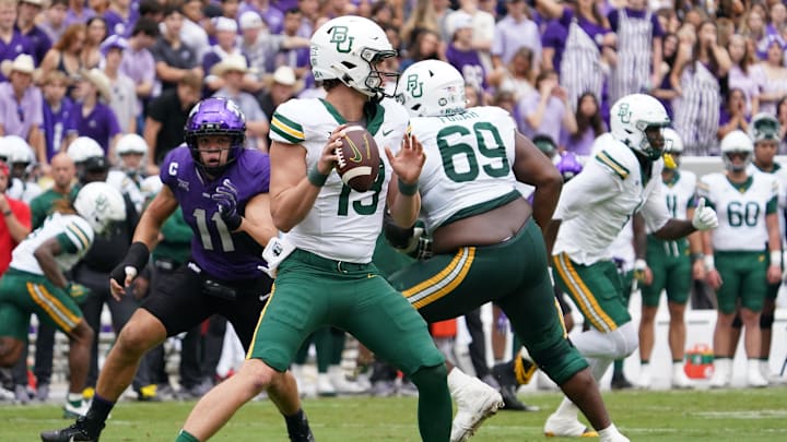 Oct 18, 2025; Fort Worth, Texas, USA; Baylor Bears quarterback Sawyer Robertson (13) stands in the pocket against the TCU Horned Frogs during the first half of a game at Amon G. Carter Stadium. Mandatory Credit: Raymond Carlin III-Imagn Images Oct 18, 2025; Fort Worth, Texas, USA; Baylor Bears quarterback Sawyer Robertson (13) stands in the pocket against the TCU Horned Frogs during the first half of a game at Amon G. Carter Stadium. Mandatory Credit: Raymond Carlin III-Imagn Images