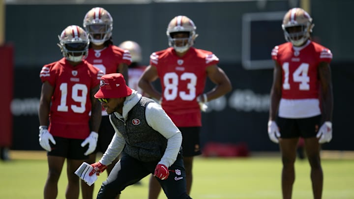 Jun 11, 2025; Santa Clara, CA, USA; San Francisco 49ers wide receiver coach Leonard Hankerson (in hat) works with his receivers during a team OTA at Levi's Stadium. Mandatory Credit: D. Ross Cameron-Imagn Images Jun 11, 2025; Santa Clara, CA, USA; San Francisco 49ers wide receiver coach Leonard Hankerson (in hat) works with his receivers during a team OTA at Levi's Stadium. Mandatory Credit: D. Ross Cameron-Imagn Images