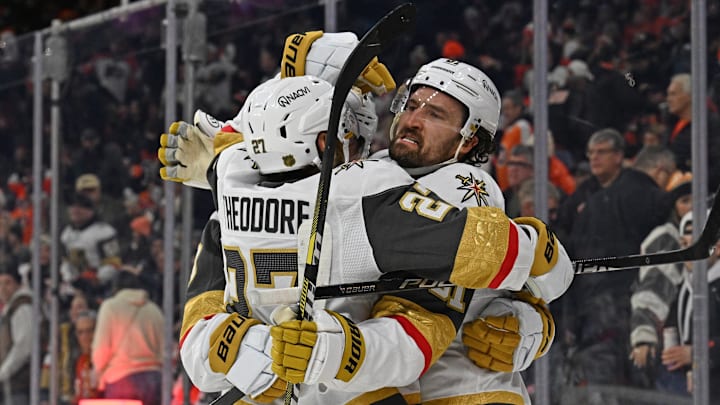 Dec 11, 2025; Philadelphia, Pennsylvania, USA; Vegas Golden Knights right wing Mark Stone (61) celebrates his game winning goal with defenseman Shea Theodore (27) center Jack Eichel (9) against the Philadelphia Flyers during the overtime period at Xfinity Mobile Arena. Mandatory Credit: Eric Hartline-Imagn Images
