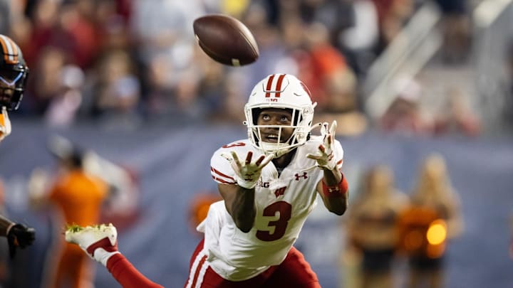 Dec 27, 2022; Phoenix, Arizona, USA; Wisconsin Badgers wide receiver Keontez Lewis (3) attempts to catch a pass against the Oklahoma State Cowboys in the first half of the 2022 Guaranteed Rate Bowl at Chase Field. Mandatory Credit: Mark J. Rebilas-Imagn Images