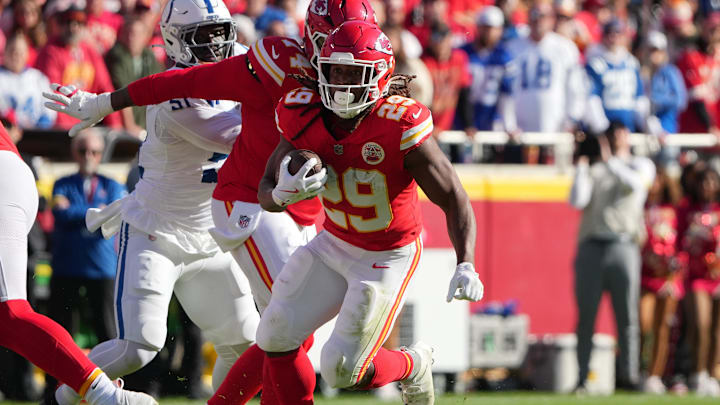 Nov 23, 2025; Kansas City, Missouri, USA;  Kansas City Chiefs running back Kareem Hunt (29) runs against the Indianapolis Colts in the first quarter at GEHA Field at Arrowhead Stadium. Mandatory Credit: Denny Medley-Imagn Images