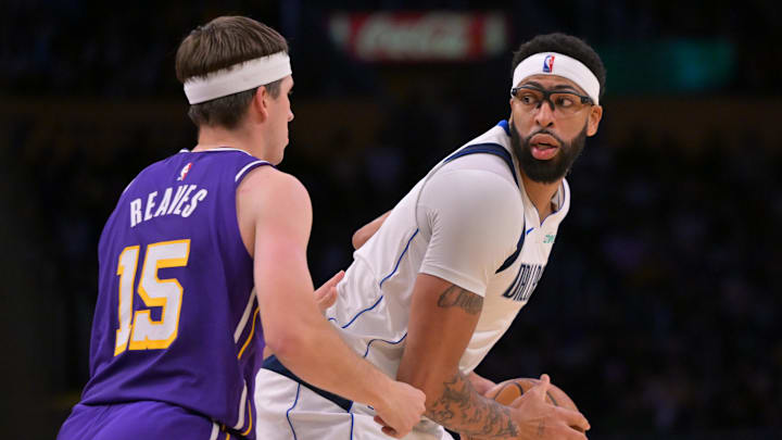Nov 28, 2025; Los Angeles, California, USA; Los Angeles Lakers guard Austin Reaves (15) defends Dallas Mavericks forward Anthony Davis (3) in the second half at Crypto.com Arena. Mandatory Credit: Jayne Kamin-Oncea-Imagn Images Nov 28, 2025; Los Angeles, California, USA; Los Angeles Lakers guard Austin Reaves (15) defends Dallas Mavericks forward Anthony Davis (3) in the second half at Crypto.com Arena. Mandatory Credit: Jayne Kamin-Oncea-Imagn Images