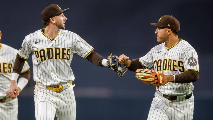 May 26, 2026; San Diego, California, USA; San Diego Padres center fielder Jackson Merrill (3) celebrates with right fielder Ramon Laureano (5) after taking a homerun away from Philadelphia Phillies left fielder Edmundo Sosa (33) during the fourth inning at Petco Park. Mandatory Credit: David Frerker-Imagn Images