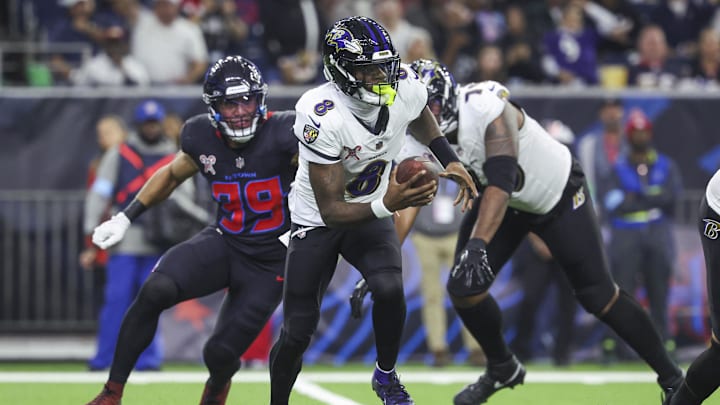 Dec 15, 2024; Houston, Texas, USA; Baltimore Ravens quarterback Lamar Jackson (8) runs with the ball during the second quarter against the Houston Texans at NRG Stadium. Mandatory Credit: Troy Taormina-Imagn Images