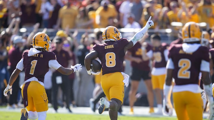 Nov 23, 2024; Tempe, Arizona, USA; Arizona State Sun Devils linebacker Jordan Crook (8) celebrates an interception with teammates against the Brigham Young Cougars in the first half at Mountain America Stadium. Mandatory Credit: Mark J. Rebilas-Imagn Images