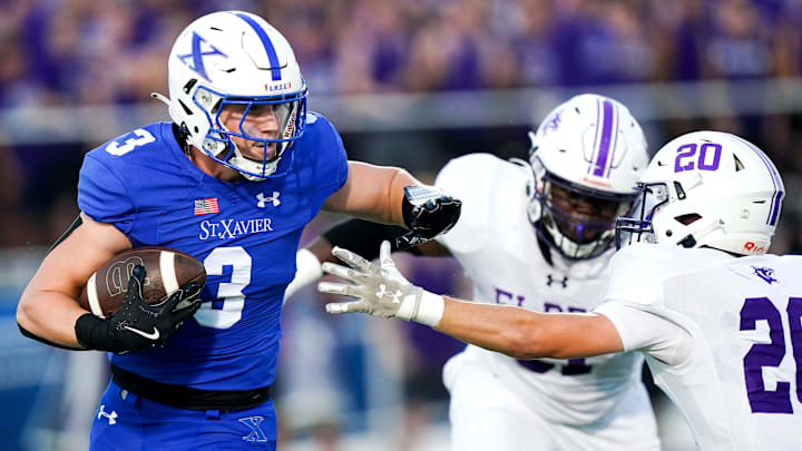 St. Xavier Bombers run the ball in the first half of a high school football game between the St. Xavier Bombers and Elder Panthers, Friday, Sept. 26, 2025, at RDI Stadium in Cincinnati.