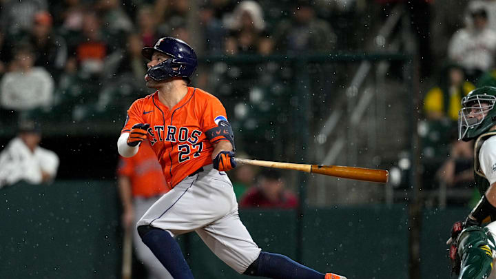 Sep 24, 2025; West Sacramento, California, USA; Houston Astros second baseman Jose Altuve (27) hits a fly ball against the Athletics in the sixth inning at Sutter Health Park. 