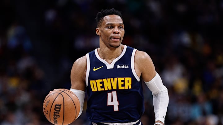 Mar 14, 2025; Denver, Colorado, USA; Denver Nuggets guard Russell Westbrook (4) controls the ball in the first quarter against the Los Angeles Lakers at Ball Arena. Mandatory Credit: Isaiah J. Downing-Imagn Images