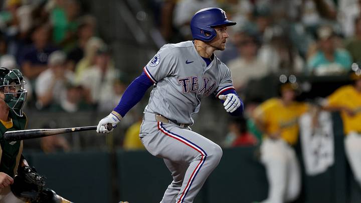 Aug 15, 2026; West Sacramento, California, USA; Texas Rangers pinch hitter Jarred Kelenic (25) hits a two RBI single against the Athletics during the ninth inning at Sutter Health Park. Mandatory Credit: Dennis Lee-Imagn Images