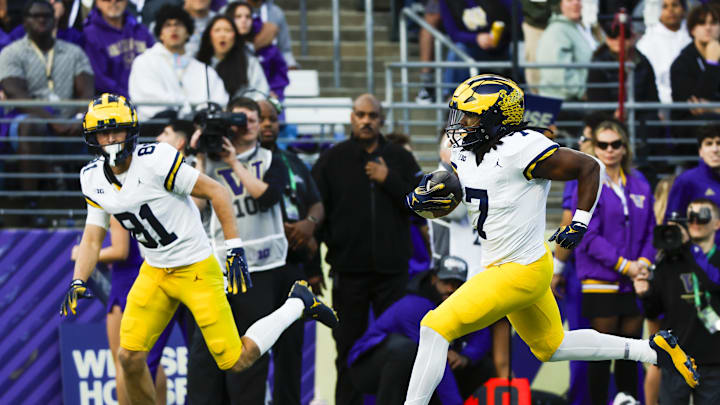 Oct 5, 2024; Seattle, Washington, USA; Michigan Wolverines running back Donovan Edwards (7) rushes for a touchdown against the Washington Huskies during the second quarter at Alaska Airlines Field at Husky Stadium. Mandatory Credit: Joe Nicholson-Imagn Images