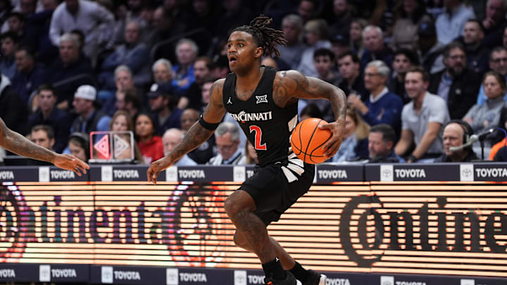 Dec 3, 2024; Villanova, Pennsylvania, USA; Cincinnati Bearcats guard Jizzle James (2) controls the ball against the Villanova Wildcats in the first half at William B. Finneran Pavilion. Mandatory Credit: Kyle Ross-Imagn Images Dec 3, 2024; Villanova, Pennsylvania, USA; Cincinnati Bearcats guard Jizzle James (2) controls the ball against the Villanova Wildcats in the first half at William B. Finneran Pavilion. Mandatory Credit: Kyle Ross-Imagn Images