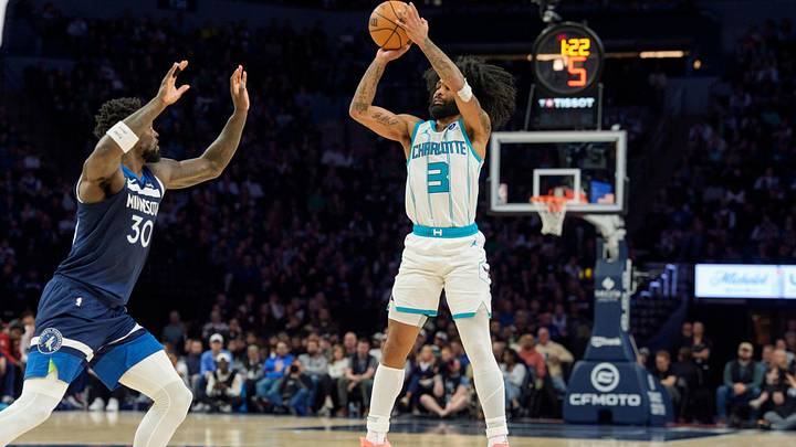 Charlotte Hornets guard Coby White (3) shoots over the defense of Minnesota Timberwolves forward Julius Randle Charlotte Hornets guard Coby White (3) shoots over the defense of Minnesota Timberwolves forward Julius Randle