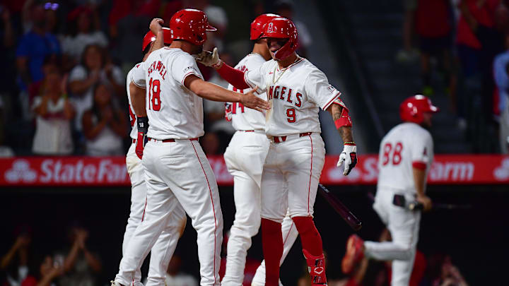 August 3, 2024; Anaheim, California, USA; Los Angeles Angels shortstop Zach Neto (9) is greeted by first baseman Nolan Schanuel (18) after hitting a three-run home run against the New York Mets during the seventh inning at Angel Stadium. Mandatory Credit: Gary A. Vasquez-Imagn Images