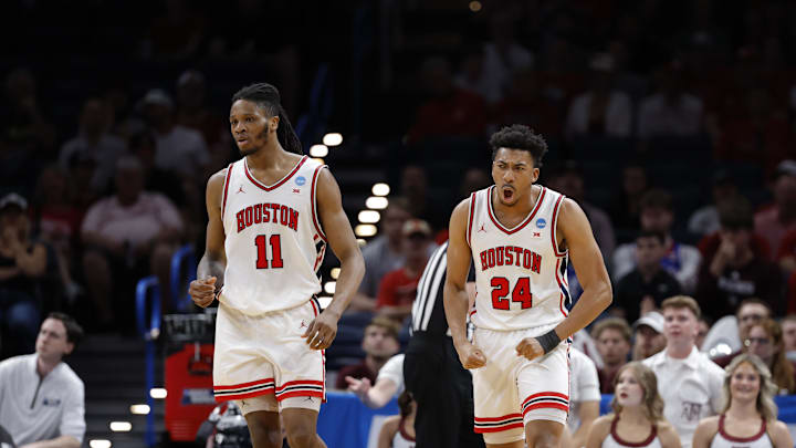 Mar 21, 2026; Oklahoma City, OK, USA; Houston Cougars forward Joseph Tugler (11) and Houston Cougars forward Chase McCarty (24) react during the first half against the Texas A&M Aggies in a second round game of the men's 2026 NCAA Tournament at Paycom Center. 