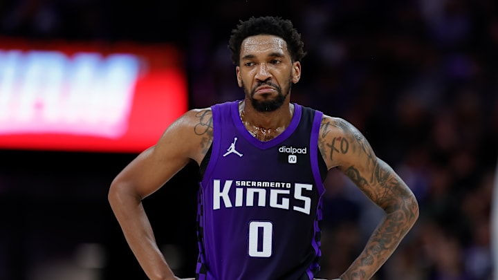 Mar 26, 2024; Sacramento, California, USA; Sacramento Kings guard Malik Monk (0) looks on during the fourth quarter against the Dallas Mavericks at Golden 1 Center. Mandatory Credit: Sergio Estrada-Imagn Images