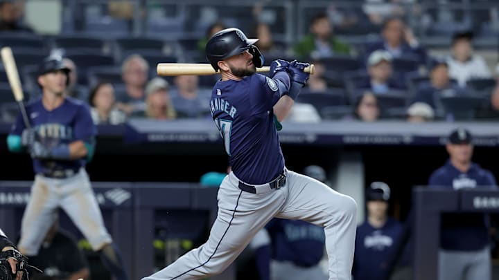 Seattle Mariners designated hitter Mitch Haniger (17) follows through on an RBI single against the New York Yankees during the ninth inning at Yankee Stadium in 2024.
