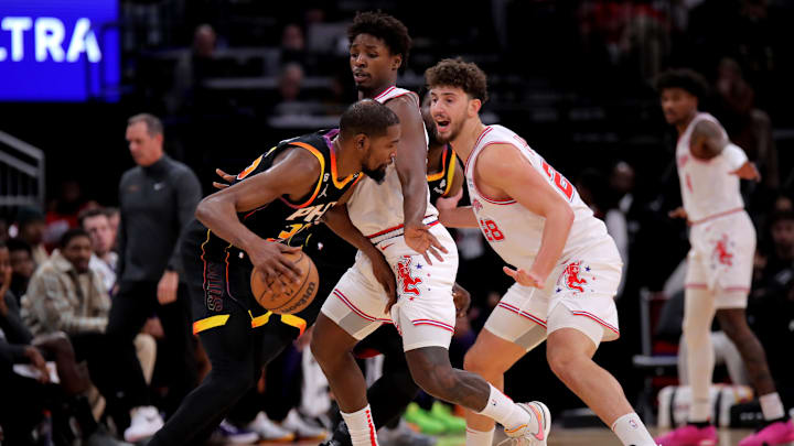 Dec 27, 2023; Houston, Texas, USA; Phoenix Suns forward Kevin Durant (35) handles the ball against Houston Rockets center Alperen Sengun (28) during the second quarter at Toyota Center. Mandatory Credit: Erik Williams-Imagn Images