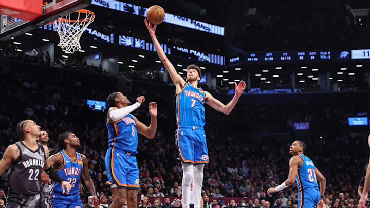 Feb 26, 2025; Brooklyn, New York, USA;  Oklahoma City Thunder forward Chet Holmgren (7) grabs a rebound in the fourth quarter against the Brooklyn Nets at Barclays Center. Mandatory Credit: Wendell Cruz-Imagn Images