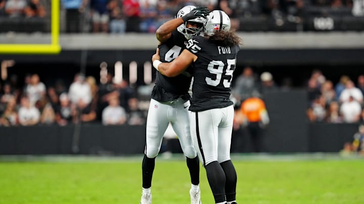 Oct 12, 2025; Paradise, Nevada, USA; Las Vegas Raiders defensive tackle Thomas Booker (99) reacts after a play during the second half against the Tennessee Titans at Allegiant Stadium. Mandatory Credit: Stephen R. Sylvanie-Imagn Images