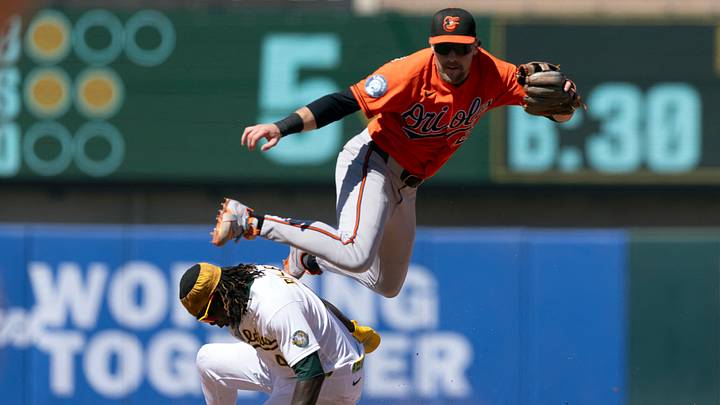 Aug 30, 2026; West Sacramento, California, USA;  Baltimore Orioles shortstop Gunnar Henderson (2) throws over Athletics right fielder Lawrence Butler (4) to complete a double play during the fifth inning at Sutter Health Park. Donovan Walton was out at first base.  Mandatory Credit: D. Ross Cameron-Imagn Images