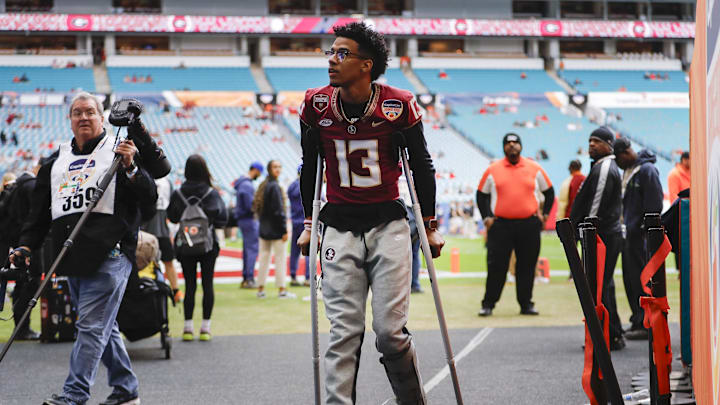 Dec 30, 2023; Miami Gardens, FL, USA; Florida State Seminoles quarterback Jordan Travis (13) looks on prior to the game against the Georgia Bulldogs in the 2023 Orange Bowl at Hard Rock Stadium. Mandatory Credit: Sam Navarro-Imagn Images