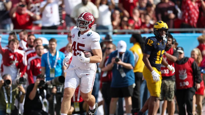 Dec 31, 2024; Tampa, FL, USA; Alabama Crimson Tide tight end Robbie Ouzts (45) scores a touchdown against the Michigan Wolverines in the second quarter during the ReliaQuest Bowl at Raymond James Stadium. Mandatory Credit: Nathan Ray Seebeck-Imagn Images Dec 31, 2024; Tampa, FL, USA; Alabama Crimson Tide tight end Robbie Ouzts (45) scores a touchdown against the Michigan Wolverines in the second quarter during the ReliaQuest Bowl at Raymond James Stadium. Mandatory Credit: Nathan Ray Seebeck-Imagn Images