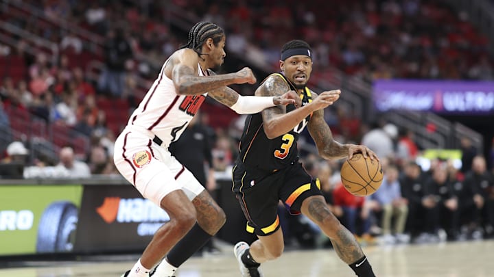 Mar 12, 2025; Houston, Texas, USA; Phoenix Suns guard Bradley Beal (3) dribbles the ball as Houston Rockets guard Jalen Green (4) defends during the first quarter at Toyota Center. Mandatory Credit: Troy Taormina-Imagn Images