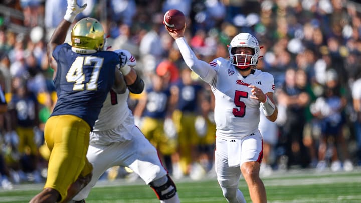 Sep 21, 2024; South Bend, Indiana, USA; Miami Redhawks quarterback Brett Gabbert (5) throws in the second quarter against the Notre Dame Fighting Irish at Notre Dame Stadium. Mandatory Credit: Matt Cashore-Imagn Images