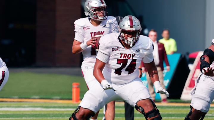 Sep 17, 2022; Boone, North Carolina, USA; Troy Trojans offensive lineman Daniel King (74) guards quarterback Gunnar Watson (18) during the first quarter against the Appalachian State Mountaineers at Kidd Brewer Stadium. Mandatory Credit: Reinhold Matay-Imagn Images