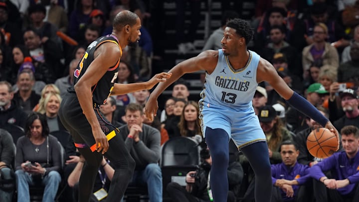 Feb 11, 2025; Phoenix, Arizona, USA; Phoenix Suns forward Kevin Durant (35) guards Memphis Grizzlies forward Jaren Jackson Jr. (13) during the first half at Footprint Center. Mandatory Credit: Joe Camporeale-Imagn Images