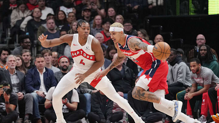 Nov 13, 2023; Toronto, Ontario, CAN; Washington Wizards forward Kyle Kuzma (33) controls the ball as Toronto Raptors forward Scottie Barnes (4) defends during the first quarter at Scotiabank Arena. Mandatory Credit: Nick Turchiaro-Imagn Images Nov 13, 2023; Toronto, Ontario, CAN; Washington Wizards forward Kyle Kuzma (33) controls the ball as Toronto Raptors forward Scottie Barnes (4) defends during the first quarter at Scotiabank Arena. Mandatory Credit: Nick Turchiaro-Imagn Images