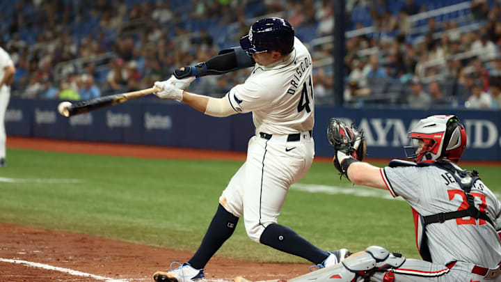 St. Petersburg, Florida, USA; Tampa Bay Rays catcher Logan Driscoll (41) hits an RBI single for his first career MLB hit during the third inning against the Minnesota Twins at Tropicana Field.
