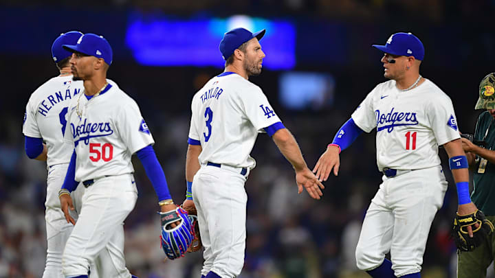 Aug 29, 2024; Los Angeles, California, USA; Los Angeles Dodgers first baseman Enrique Hernandez (8). right fielder Mookie Betts (50) Los Angeles Dodgers third baseman Chris Taylor (3) and shortstop Miguel Rojas (11) celebrate the victory against the Baltimore Orioles at Dodger Stadium. Mandatory Credit: Gary A. Vasquez-Imagn Images