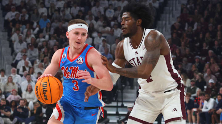 Jan 18, 2025; Starkville, Mississippi, USA; Mississippi Rebels guard Sean Pedulla (3) drives to the basket as Mississippi State Bulldogs forward Cameron Matthews (4) defends during the first half at Humphrey Coliseum. Mandatory Credit: Petre Thomas-Imagn Images