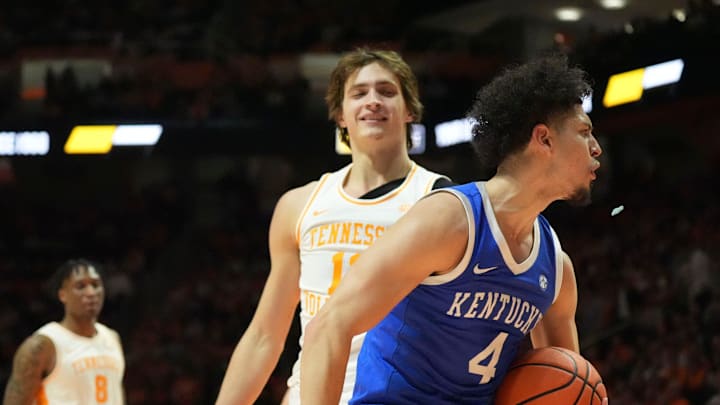 Tennessee's Cade Phillips (12) smiles Kentucky's Koby Brea (4) reacts a foul on him during an NCAA college basketball game on Tuesday, Jan. 28, 2025, in Knoxville, Tenn.