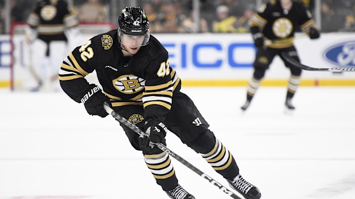 Sep 29, 2023; Boston, Massachusetts, USA;  Boston Bruins center Georgii Merkulov (42) skates with the puck during a preseason game against the Philadelphia Flyers