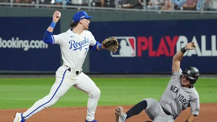 Kansas City Royals shortstop Bobby Witt Jr. (7) gets the force out on New York Yankees shortstop Anthony Volpe (11) at second base and throws to first during game four of the NLDS for the 2024 MLB Playoffs at Kauffman Stadium on Oct 10, 2024.