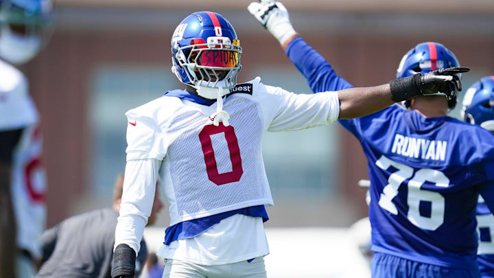 New York Giants linebacker Brian Burns (0) points after a play.
