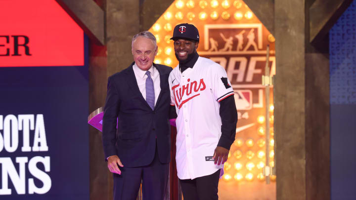 Jul 14, 2024; Ft. Worth, TX, USA;  MLB Commissioner Rob Manfred takes a photo with Kaelen Culpepper after he was drafted by the Minnesota Twins with the 21st pick during the first round of the MLB Draft at Cowtown Coliseum. Mandatory Credit: Kevin Jairaj-USA TODAY Sports
