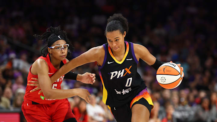 Aug 10, 2025; Phoenix, Arizona, USA; Phoenix Mercury forward Satou Sabally (0) drives to the basket against Atlanta Dream guard Allisha Gray (15) in the second half at PHX Arena. Mandatory Credit: Mark J. Rebilas-Imagn Images
