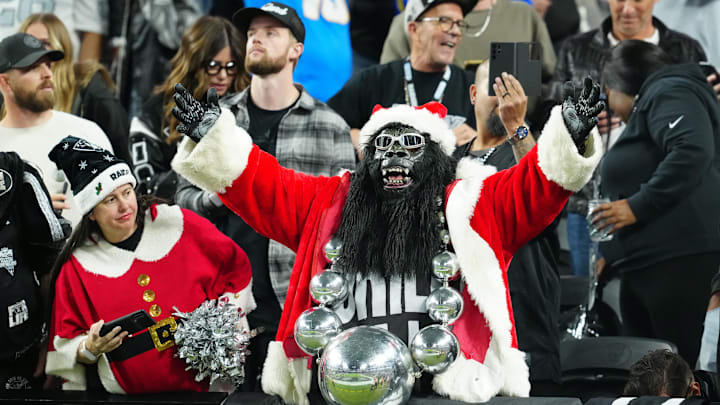 Dec 14, 2023; Paradise, Nevada, USA; Las Vegas Raiders fans dressed up for Christmas cheer during the first quarter against the Los Angeles Chargers  at Allegiant Stadium. Mandatory Credit: Stephen R. Sylvanie-Imagn Images