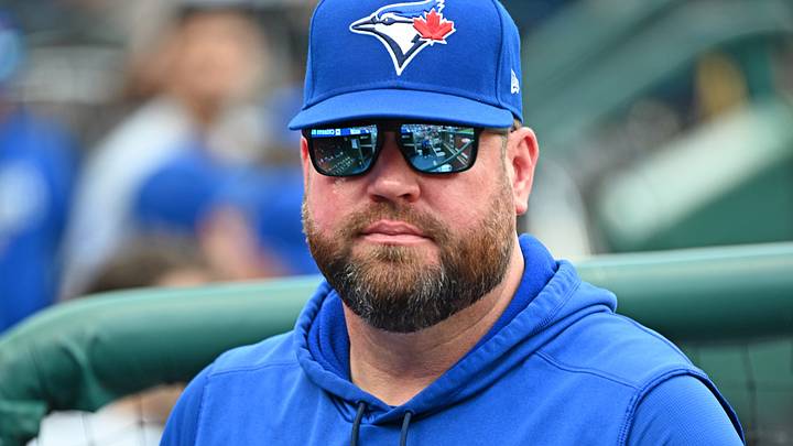 Toronto Blue Jays manager John Schneider (14) before a game. Credit: Eric Hartline-Imagn