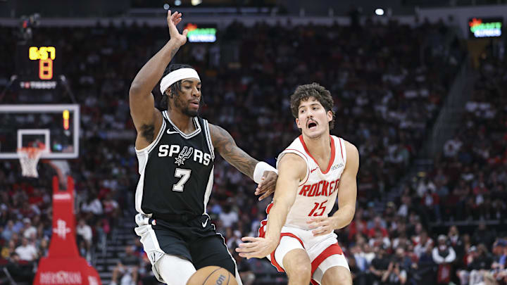 Nov 6, 2024; Houston, Texas, USA; Houston Rockets guard Reed Sheppard (15) passes the ball around San Antonio Spurs guard David Duke Jr. (7) during the fourth quarter at Toyota Center. Mandatory Credit: Troy Taormina-Imagn Images Nov 6, 2024; Houston, Texas, USA; Houston Rockets guard Reed Sheppard (15) passes the ball around San Antonio Spurs guard David Duke Jr. (7) during the fourth quarter at Toyota Center. Mandatory Credit: Troy Taormina-Imagn Images
