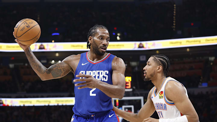 LA Clippers forward Kawhi Leonard (2) moves the ball against Oklahoma City Thunder guard Aaron Wiggins (21) during the second half at Paycom Center. LA Clippers forward Kawhi Leonard (2) moves the ball against Oklahoma City Thunder guard Aaron Wiggins (21) during the second half at Paycom Center.