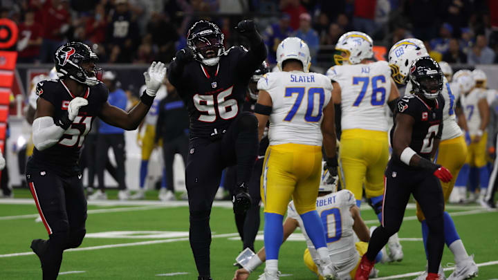Jan 11, 2025; Houston, Texas, USA; Houston Texans defensive end Denico Autry (96) celebrates sacking Los Angeles Chargers quarterback Justin Herbert (10) in the third quarter in an AFC wild card game at NRG Stadium. Mandatory Credit: Thomas Shea-Imagn Images Jan 11, 2025; Houston, Texas, USA; Houston Texans defensive end Denico Autry (96) celebrates sacking Los Angeles Chargers quarterback Justin Herbert (10) in the third quarter in an AFC wild card game at NRG Stadium. Mandatory Credit: Thomas Shea-Imagn Images