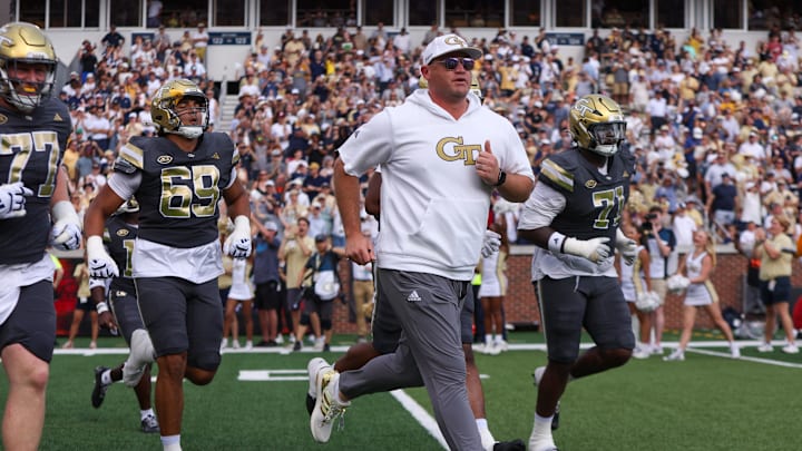 Sep 20, 2025; Atlanta, Georgia, USA; Georgia Tech Yellow Jackets head coach Brent Key runs on the field before a game against the Temple Owls at Bobby Dodd Stadium at Hyundai Field. Mandatory Credit: Brett Davis-Imagn Images
